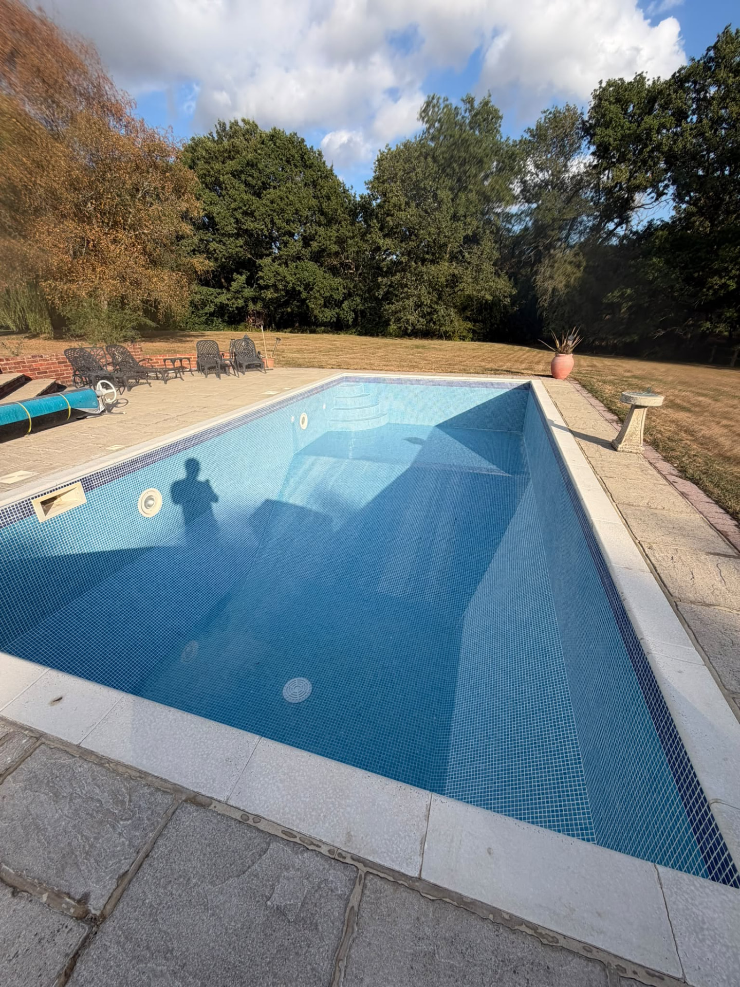 Damaged mosaic pool fully retiled