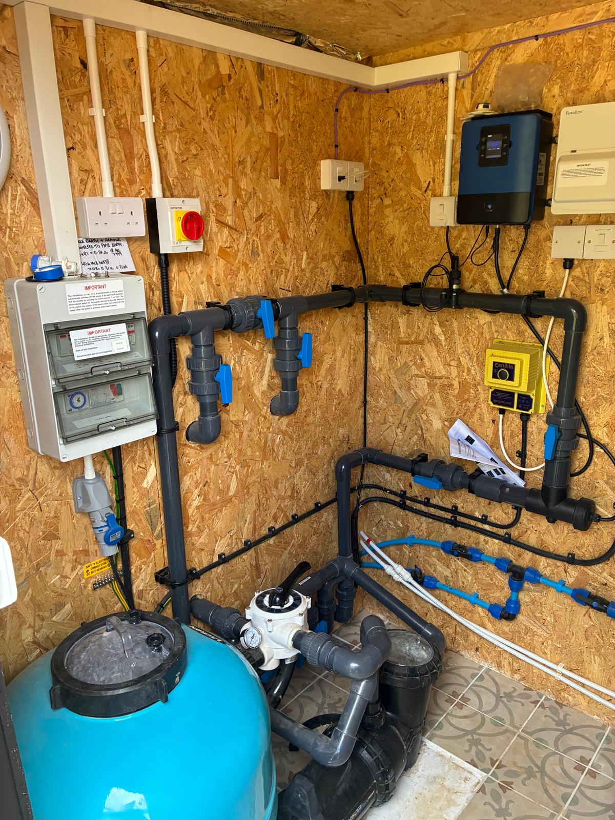 Indoor swimming pool plant room with filtration, dosing and control equipment